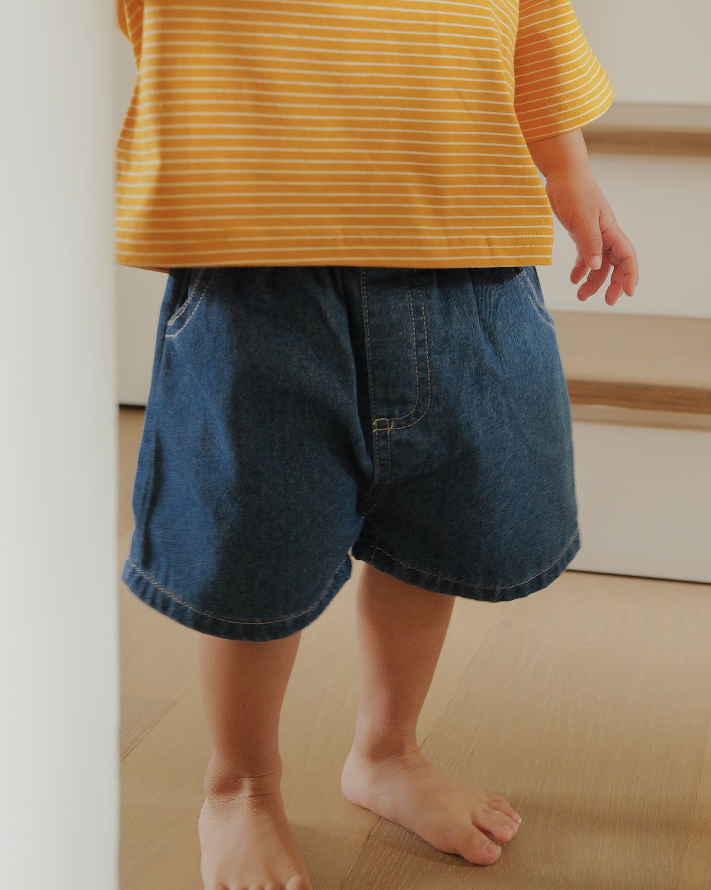 boy in denim shorts dark blue