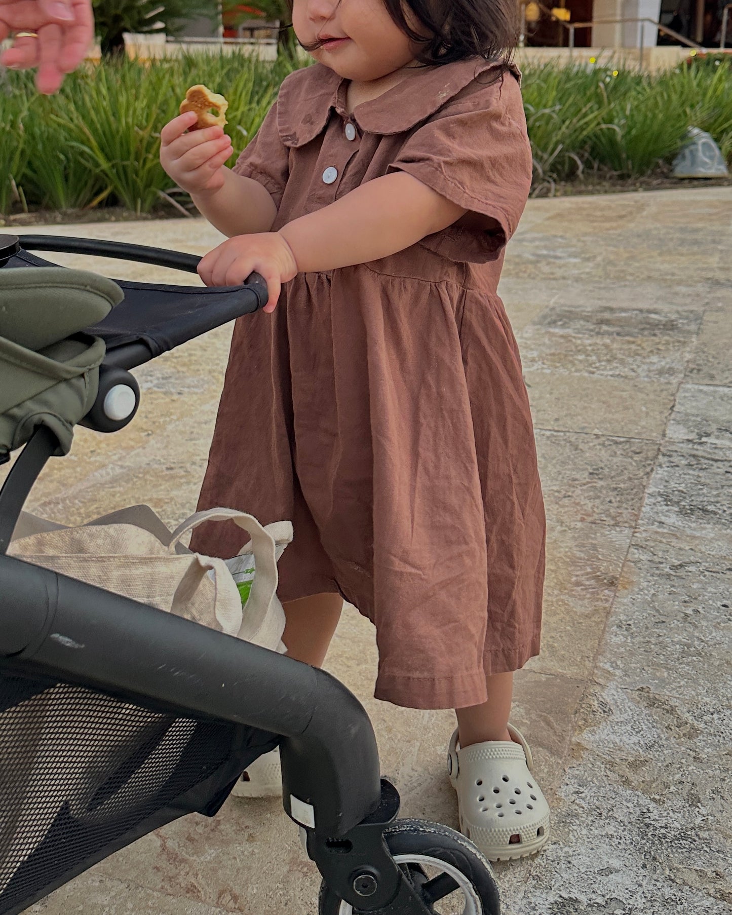 girl in brown collared dress