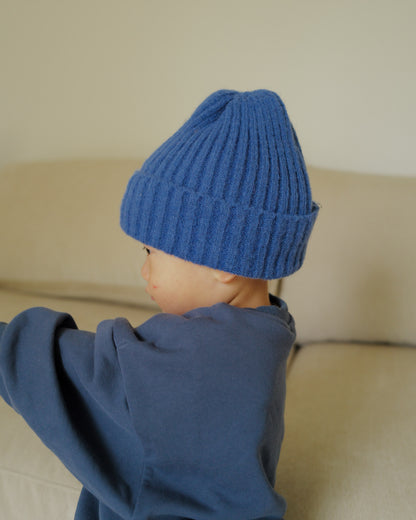 boy in blue knit beanie