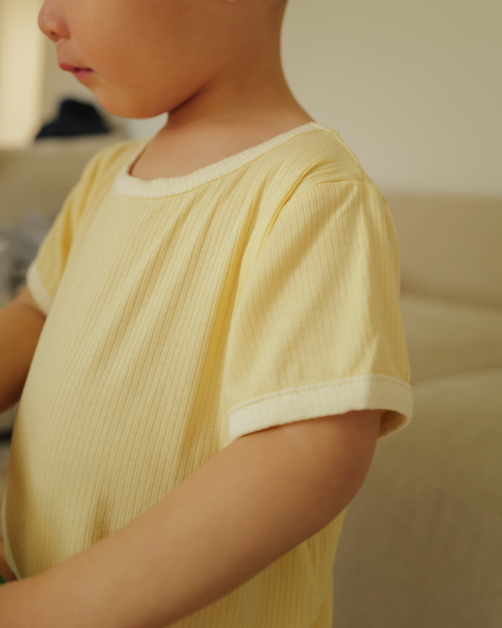 boy in summer ribbed tee yellow
