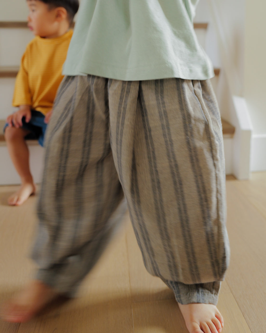 boy in tapered weave pant