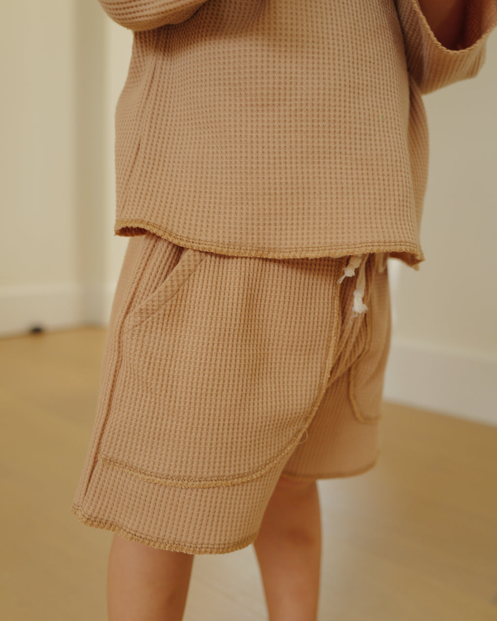 boy in waffled overlock shorts brown