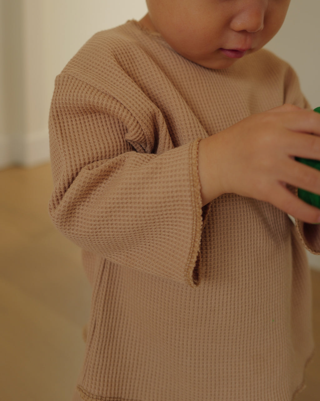 boy in waffled overlock top brown