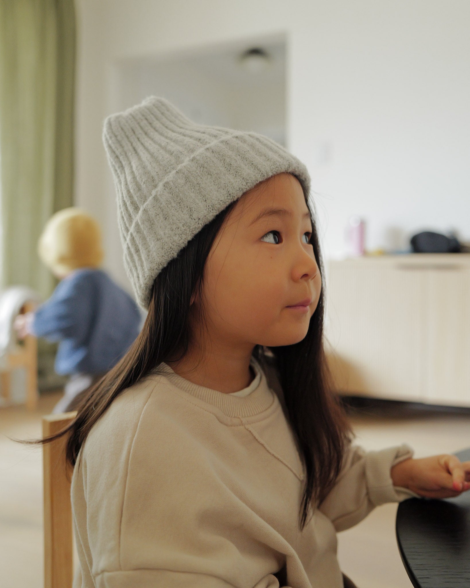 girl in grey knit beanie