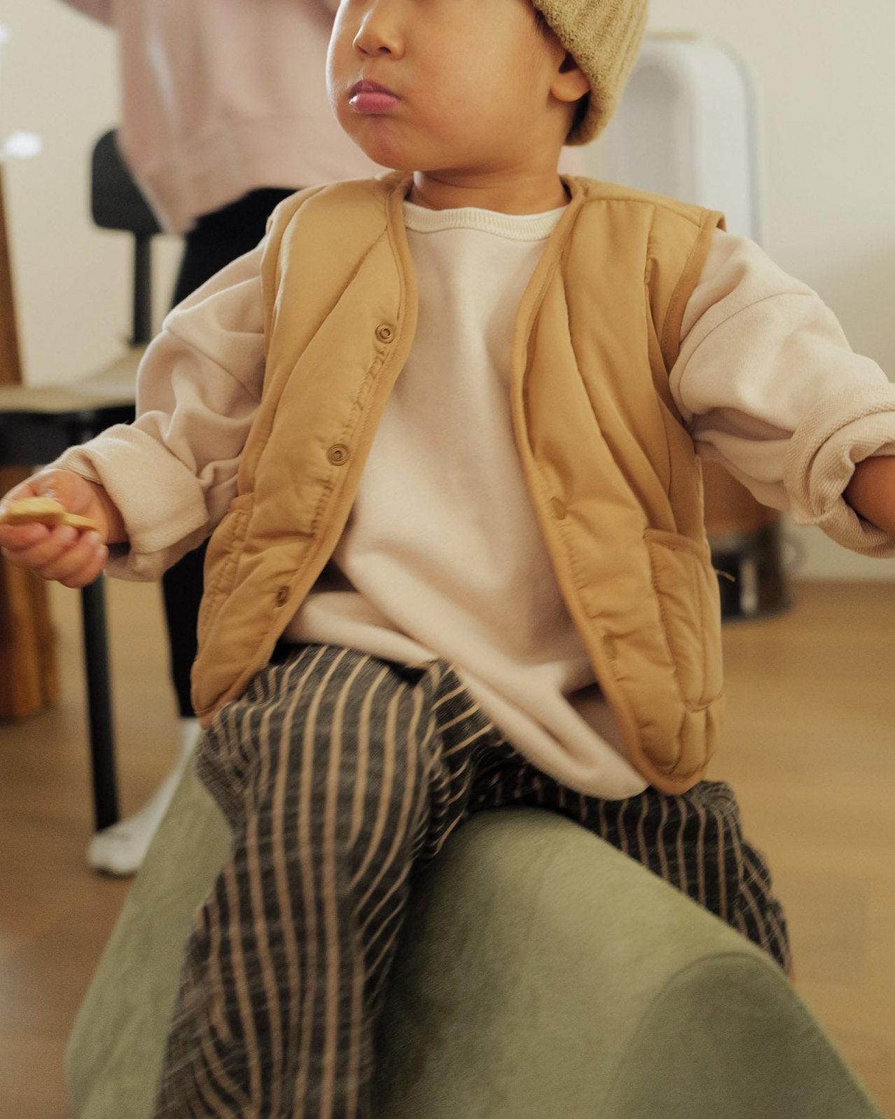 boy in light puffer vest