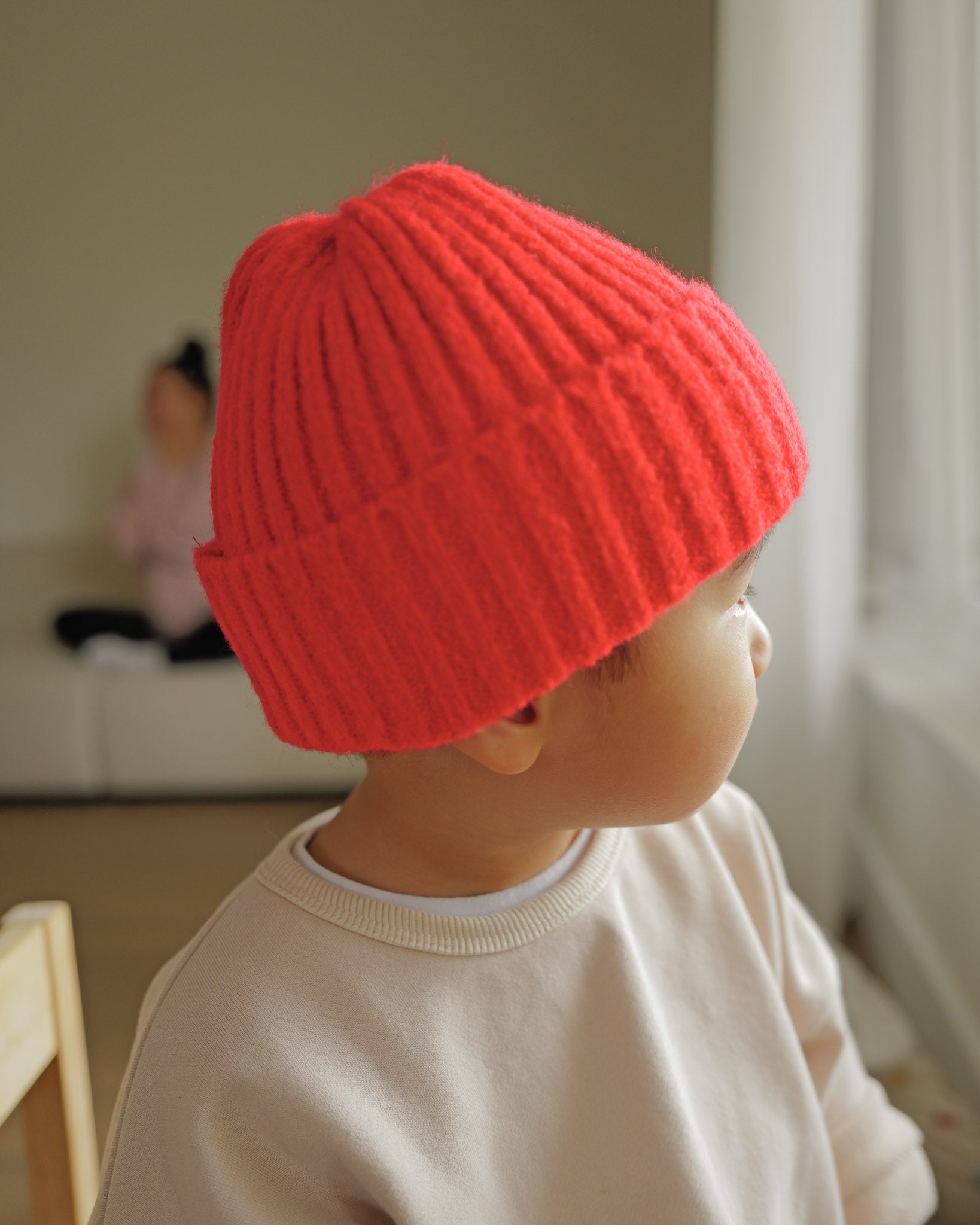 boy in red knit beanie 