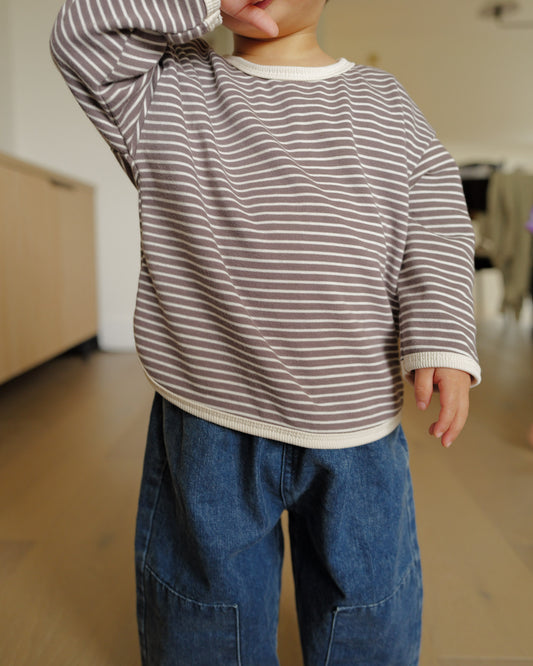 toddler boy in striped long sleeve shirt