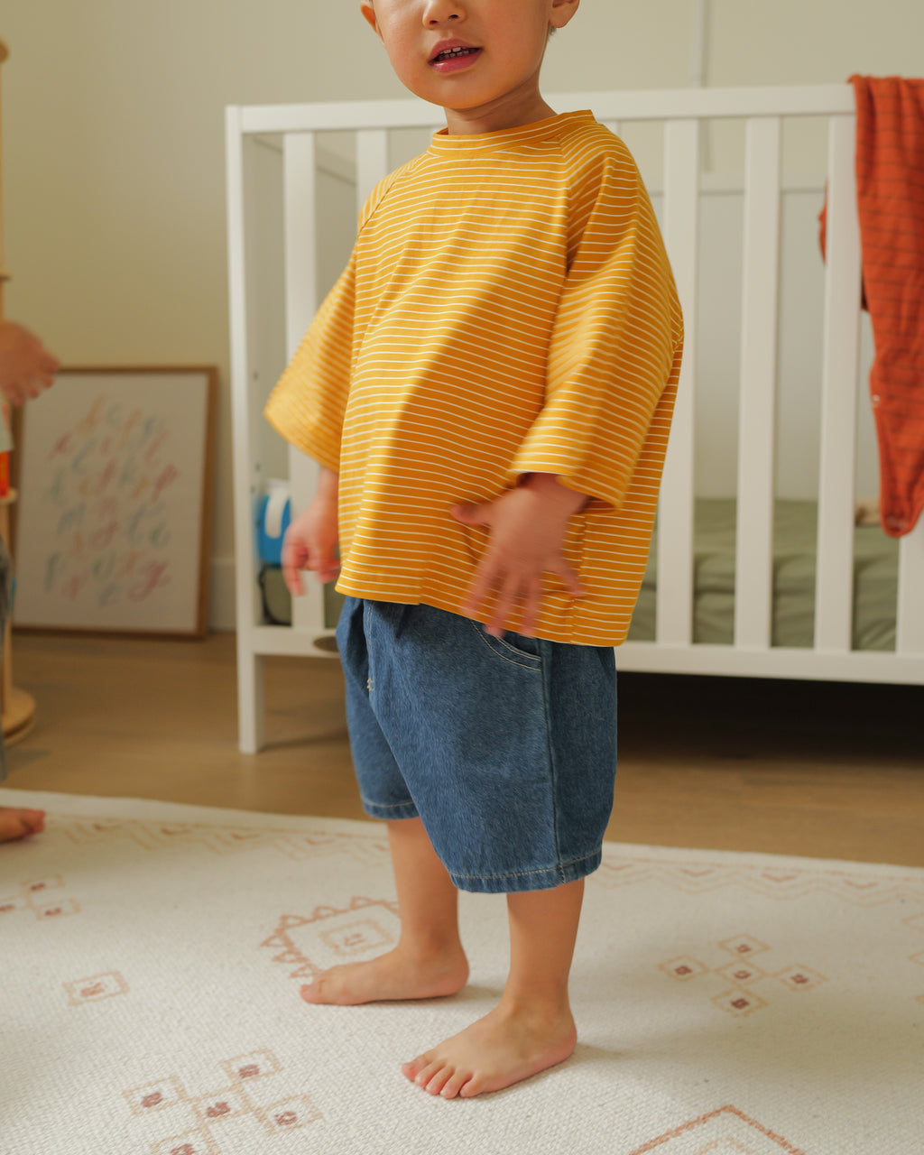toddler in dark blue denim shorts