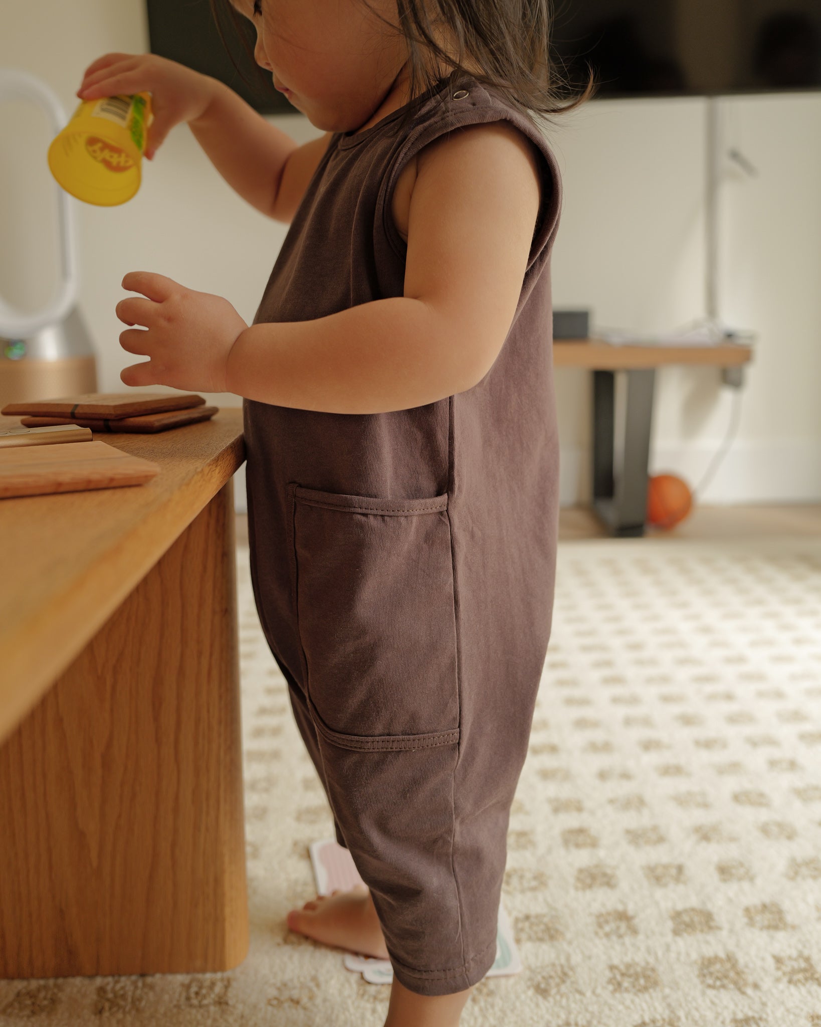 toddler in summer romper espresso