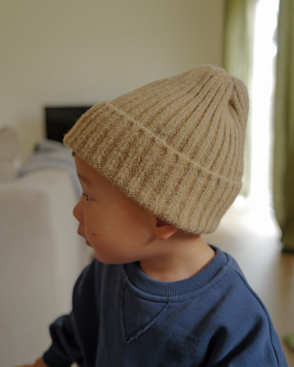 toddler in brown winter knit beanie